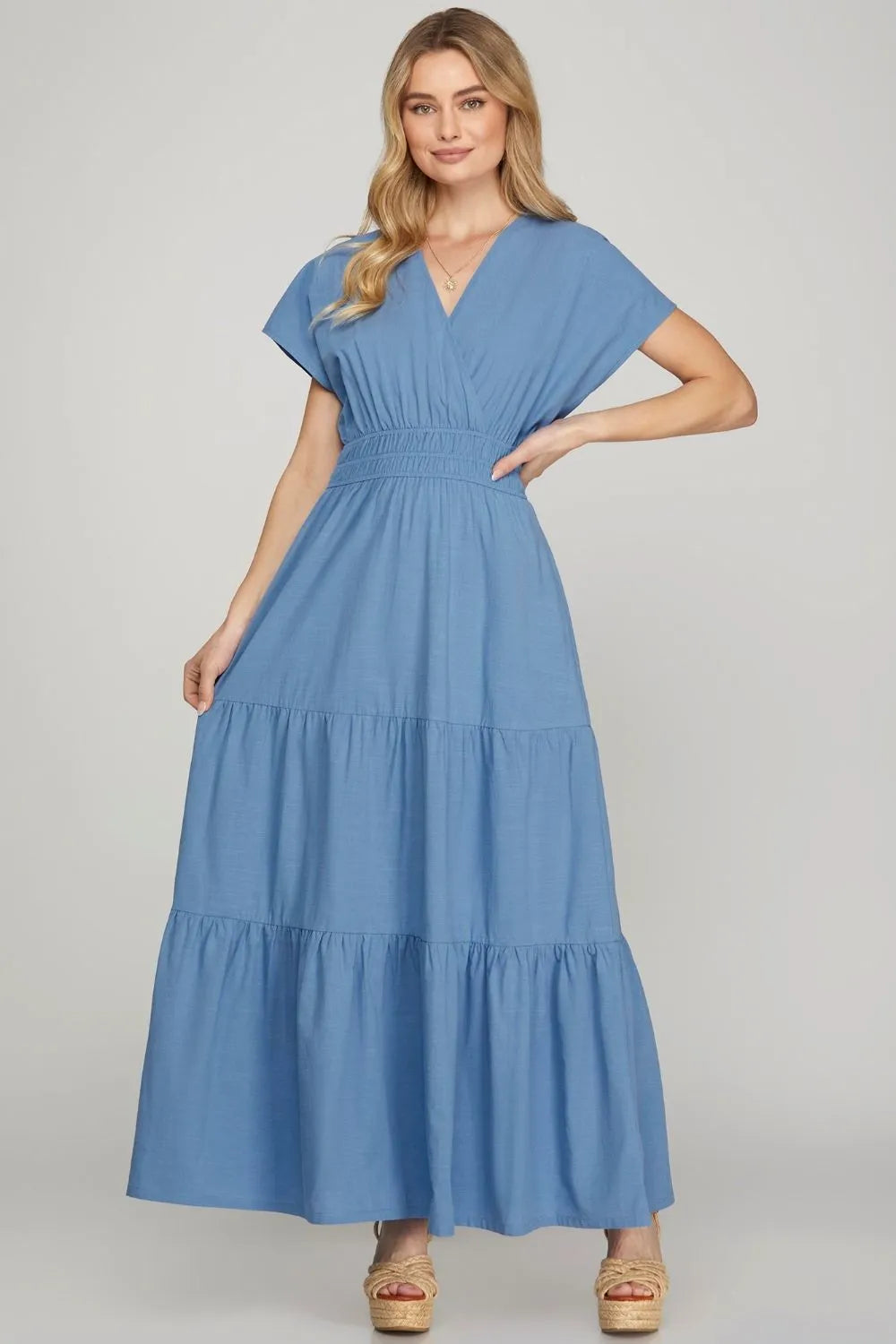 Image of She + Sky Surplice Short Sleeve Tiered Maxi Dress With Pockets | Queeble.shop