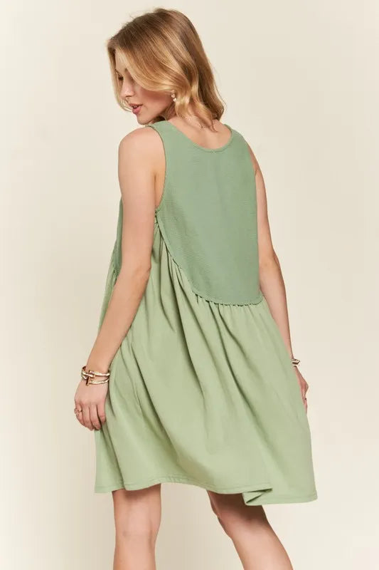 Image of ADORA Decorative Button Sleeveless Babydoll Dress | Queeble.shop
