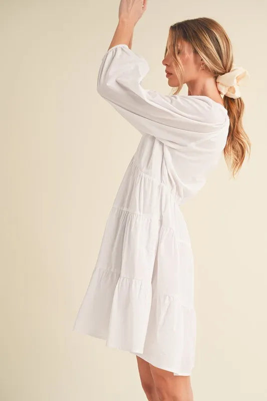 Image of Aemi + Co Notched Balloon Sleeve Tiered Mini Dress | Queeble.shop