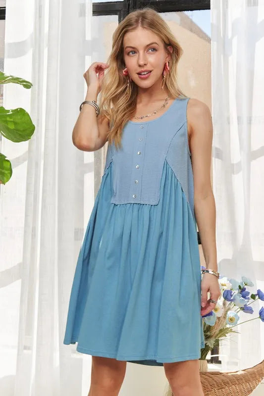 Image of ADORA Decorative Button Sleeveless Babydoll Dress | Queeble.shop