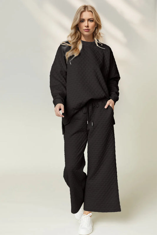 Image of Double Take Checkered Slit High-Low Round Neck Top and Wide Leg Pants Set | Queeble.shop