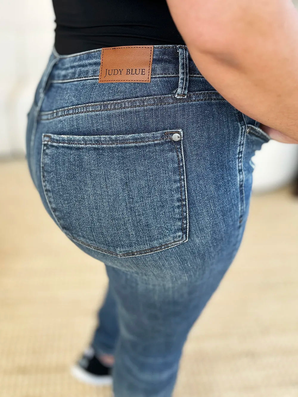 Image of Judy Blue Full Size Mid Waist Distressed Slim Jeans | Queeble.shop