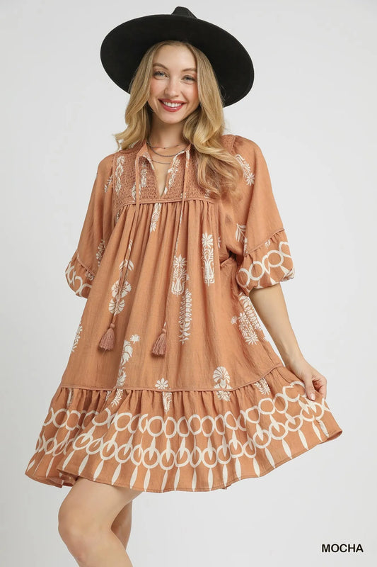 Image of Umgee Boarder Print Tassel Tie Neck Mini Dress | Queeble.shop