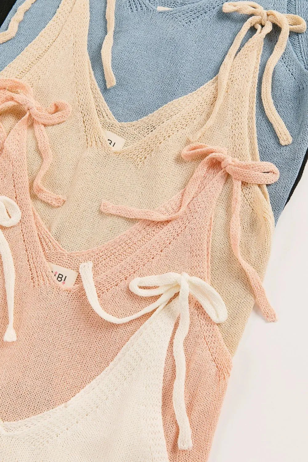 Image of BiBi Tied Shoulder Solid Knit Top | Queeble.shop