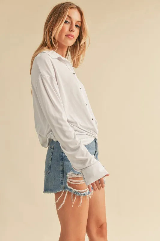 Image of Aemi + Co Twisted Hemline Button Detail Collared Neck Top | Queeble.shop