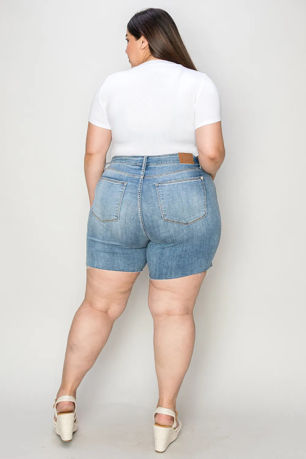Image of Judy Blue Full Size High Waist Raw Hem Denim Shorts | Queeble.shop