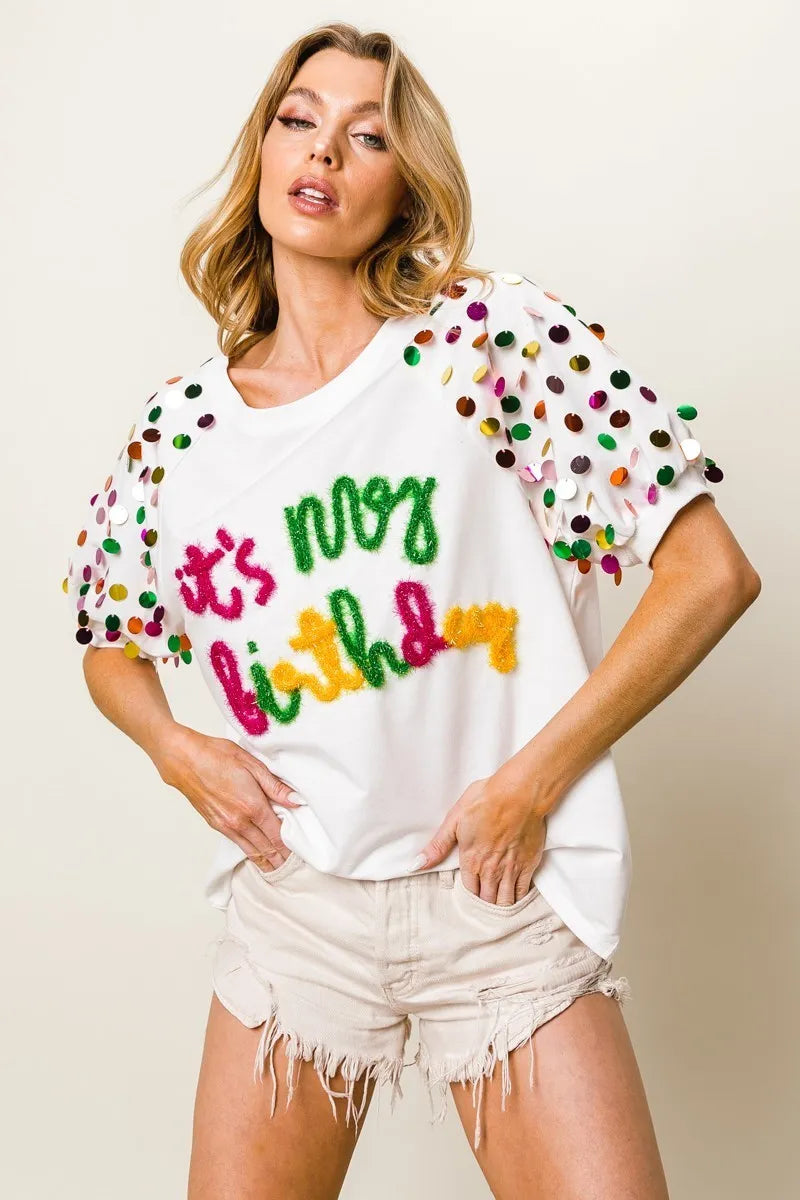 Image of BiBi Metallic Letter Spangle Raglan Puff Sleeve Top | Queeble.shop