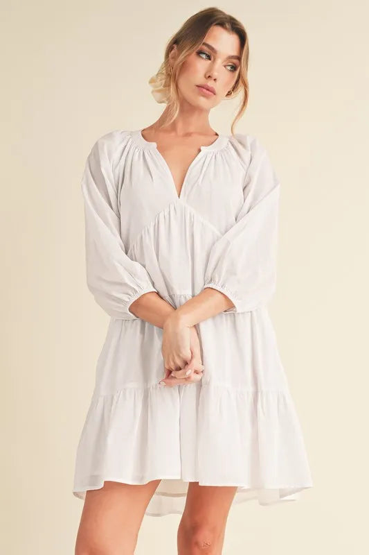 Image of Aemi + Co Notched Balloon Sleeve Tiered Mini Dress | Queeble.shop