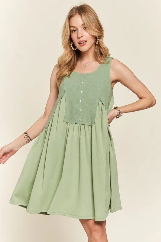 Image of ADORA Decorative Button Sleeveless Babydoll Dress | Queeble.shop