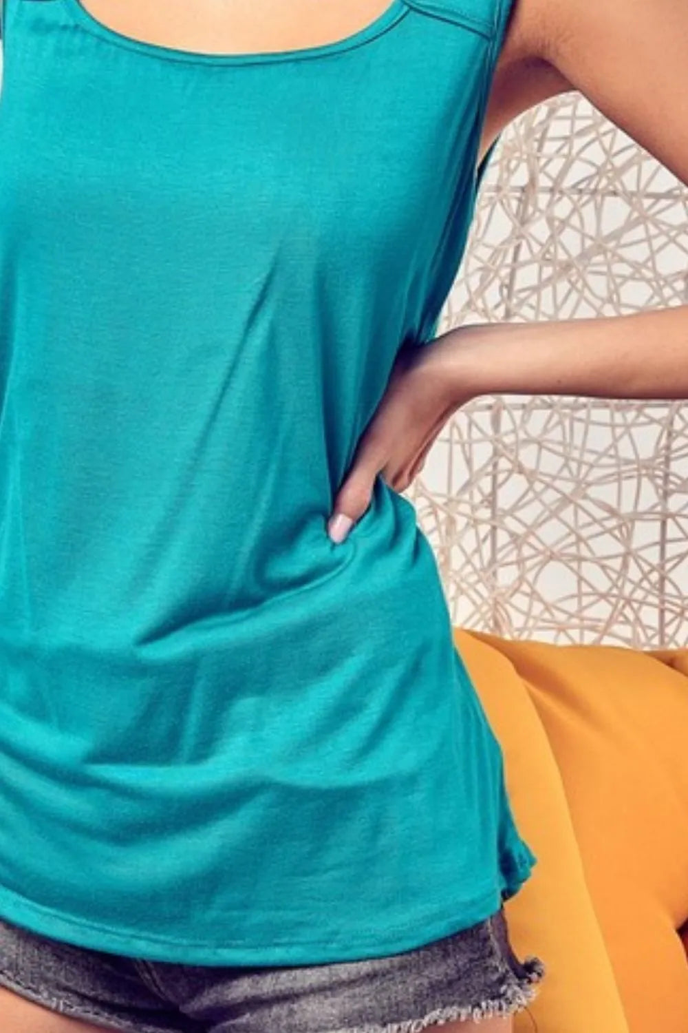 Image of BiBi Rayon Span Knit With Cut Out Front Sleeveless Top | Queeble.shop