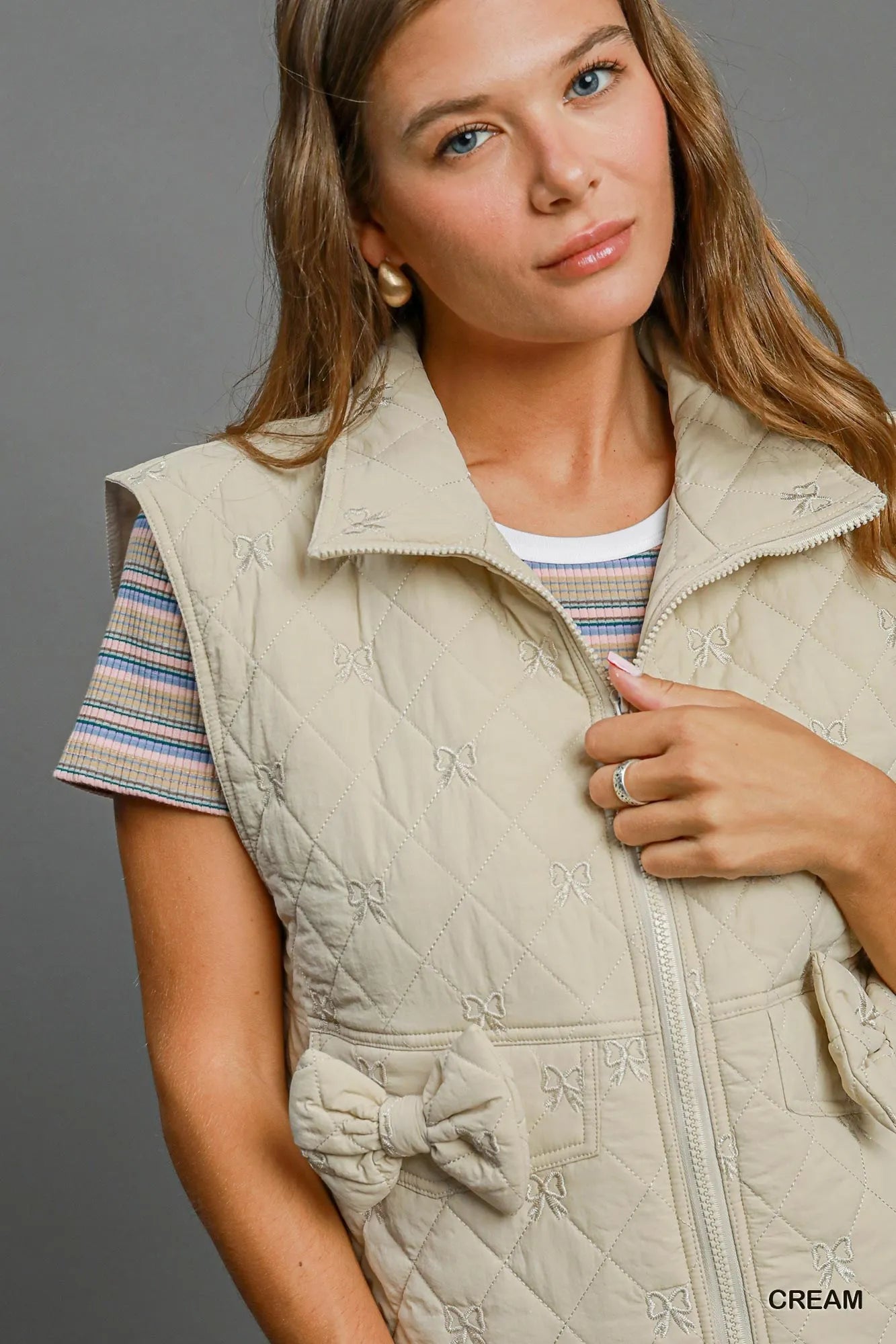 Image of Umgee Sleeveless Quilted Vest with Bow Details | Queeble.shop