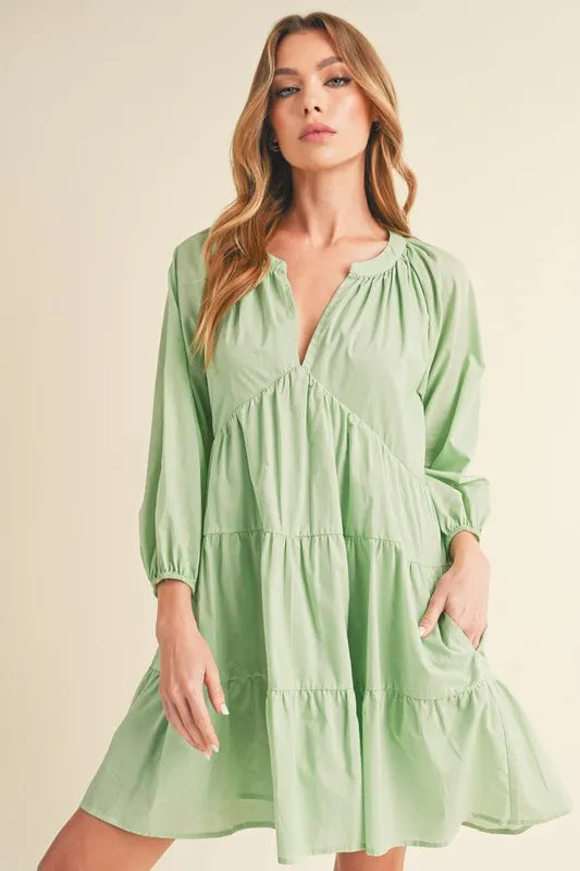 Image of Aemi + Co Notched Balloon Sleeve Tiered Mini Dress | Queeble.shop