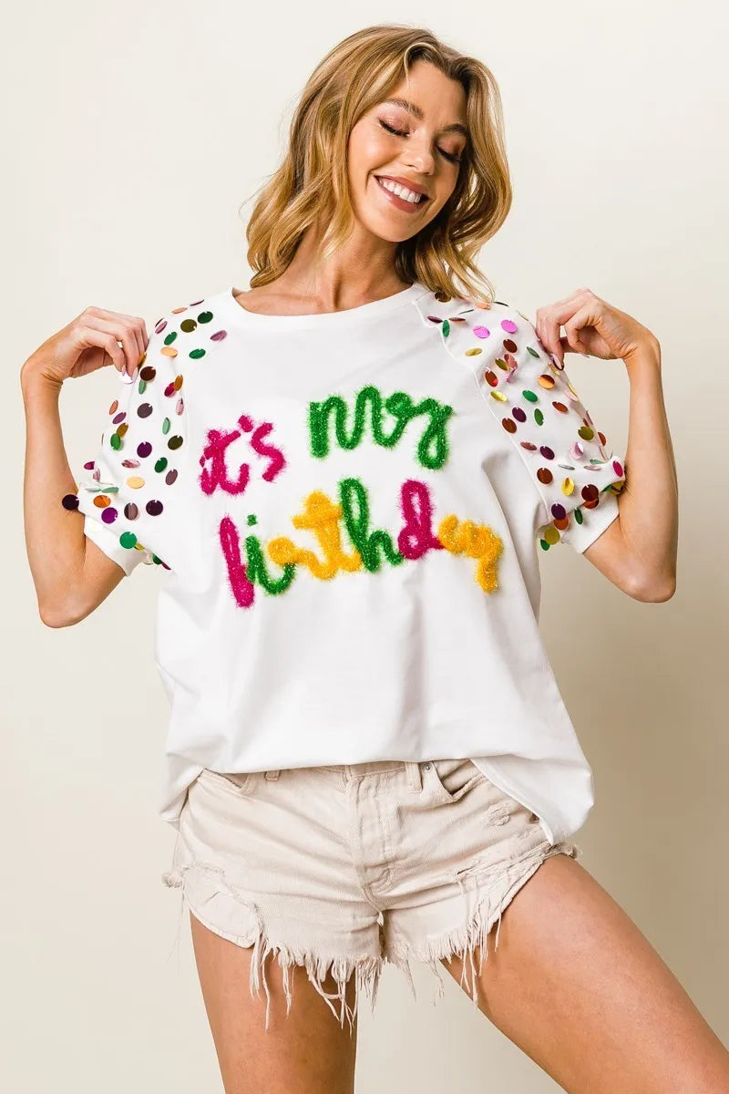 Image of BiBi Metallic Letter Spangle Raglan Puff Sleeve Top | Queeble.shop