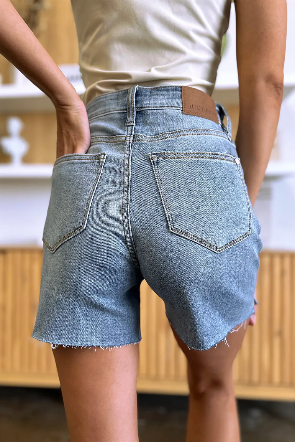 Image of Judy Blue Full Size High Waist Raw Hem Denim Shorts | Queeble.shop