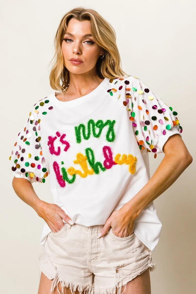 Image of BiBi Metallic Letter Spangle Raglan Puff Sleeve Top | Queeble.shop