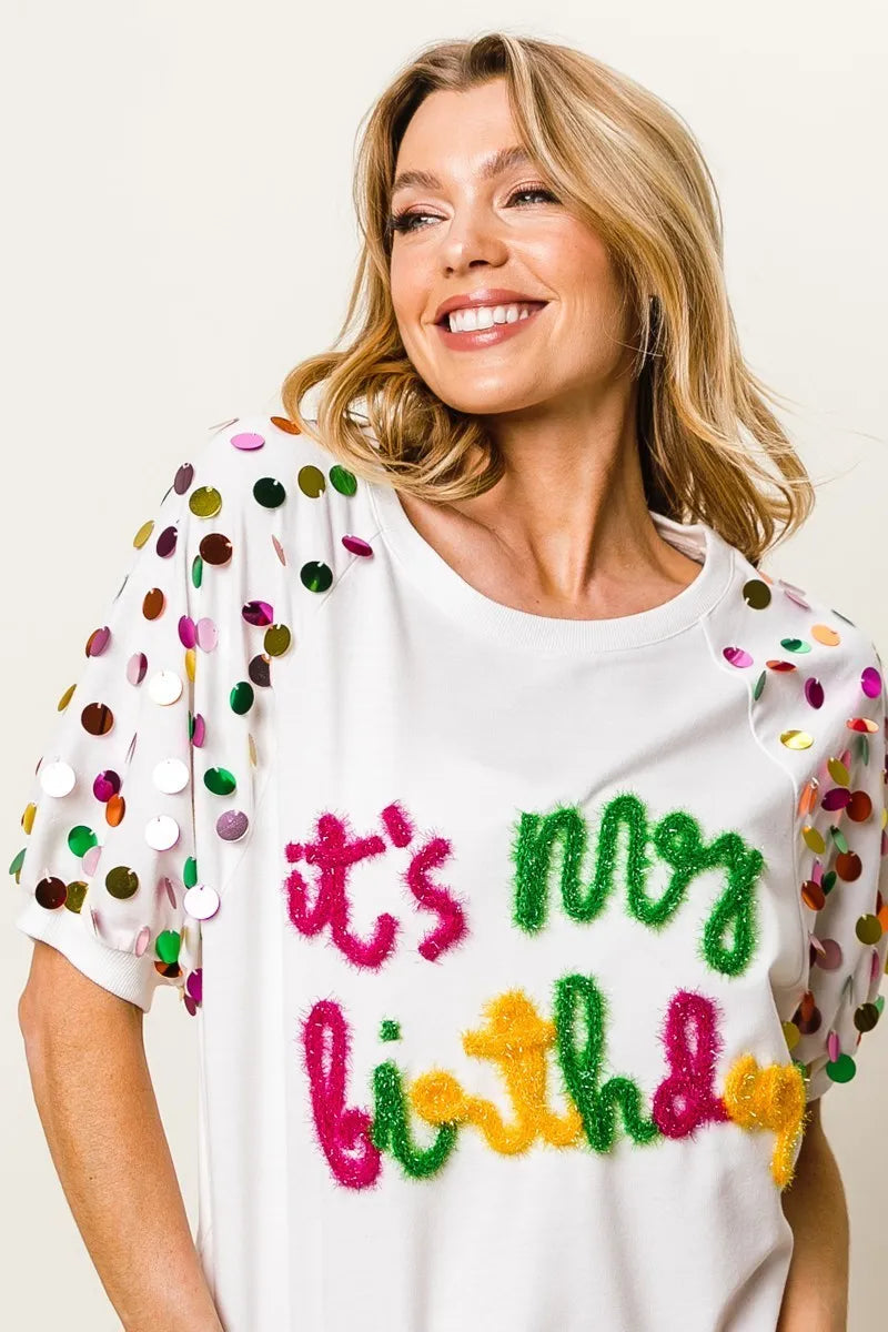Image of BiBi Metallic Letter Spangle Raglan Puff Sleeve Top | Queeble.shop