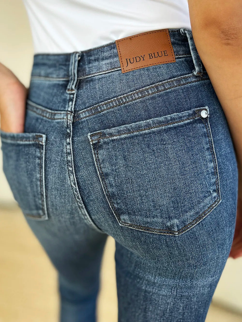 Image of Judy Blue Full Size Mid Waist Distressed Slim Jeans | Queeble.shop